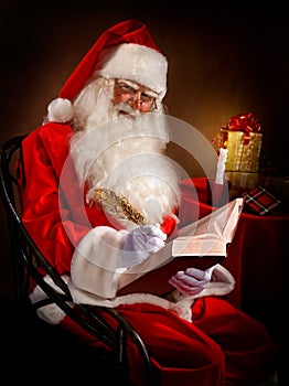 Santa Writes a Magic Feather in the Book