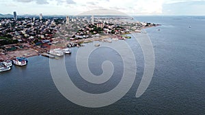 Santarem city and harbor with ferries on the Amazon river in Brazil Aerial video