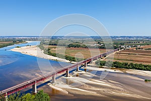 Santarem, Portugal. Ponte Dom Luis I Bridge, Tagus River and Leziria fields photo