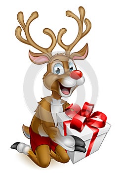 Santas Christmas Reindeer Holding a Gift photo