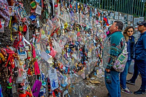 SANTIAGO, CHILE - OCTOBER 16, 2018: Unidentified p ople giving a wall with message to the dead and conmemorating a