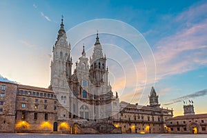 Santiago de Compostela Cathedral at sunrise with main square Praza do Obradoiro, Galicia, Spain. Galician gothic church photo