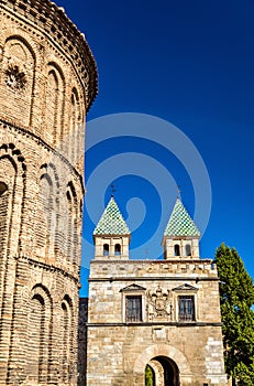 Santiago del Arrabal Church and Puerta de Bisagra Nueva Gate in Toledo, Spain photo