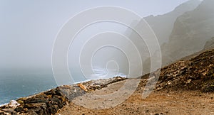 Santo Antao, Cape Verde - Sandy trail hike path from Cruzinha da Garca to Ponta do Sol. Moody Atlantic coastline with