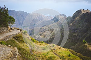 Santo Antao Island Cape Verde. Female tourist on hike enjoying view to Caculi valley from Corda photo