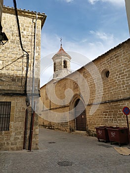 The Santo Domingo church tower, view from a side street, Ubeda, AndalucÃ­a, Spain photo