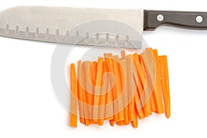 Santoku knife and carrot sticks photo
