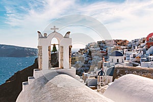 Santorini famous view with white houses and churches.