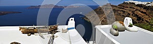 Santorini, Greece. Amazing view of blue sky and ships and buildings at sea in Santorini greek island. Location: Fira Santorini,