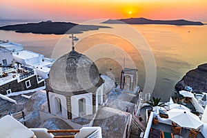 Santorini, Greece - Colored sunset scenic with Firostefani church