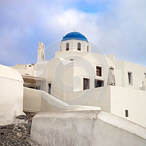 Santorini, Greece. Conceptual composition of the famous architecture of the island of Santorini. White church with a blue dome.