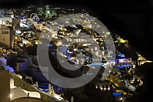 Santorini, Greece. Fira town, Oia vilage night view. A beautiful, romantic place, resulted from a super volcano eruption in Aegean photo