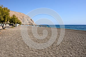 View of black sand beach of Perissa on the island of Santorini. Cyclades, Greece