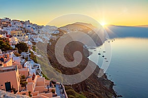 Santorini, Greece. Sunrise on the famous island of Santorini, view of the city of Oia. The sun rises and illuminates the