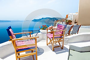 Santorini island, Greece. Two chairs on the terrace with sea view
