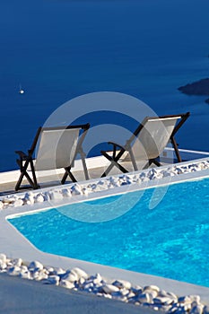 Santorini island with sunbeds in Greece