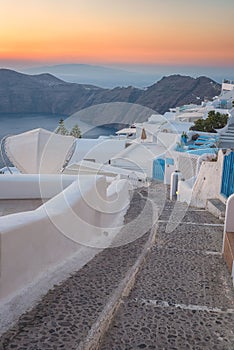 Santorini island at sunset, typical white architecture, caldera view, Imerovigli, Greece, travel background