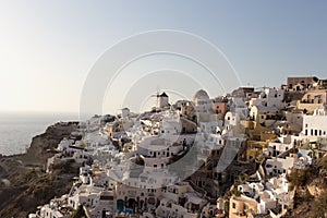 Santorini Island - view of the famous windmills at sunset