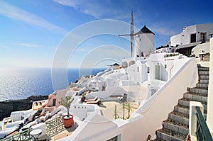 Santorini landscape with white houses and windmill, Oia Town, Santorini Island, Cyclades, Greece