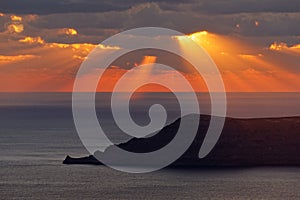 Santorini - Moody sunset on the sea with orange-red light