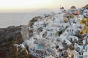Santorini Oia Greece Europe, sunset at the white village of Oia Santorini with old blue and white Greek churches at dusk