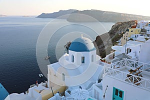Santorini traditional greek white village with blue domes of churches, Greece