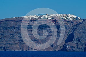 Santorini view from seaside, the unique greek island high up at the volcano rocks, a popular tourism hotspot, superb