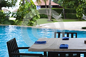 Sanya: poolside dining table