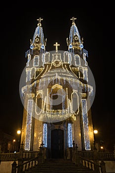 Sao Gualter Church `Igreja de Nossa Senhora da Consolacao e Santos Passos` with christmas and new years eve lights decoration