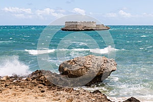 Sao Lourenco Blockhouse. San Lorenzo Island and fort nearby rocky shore and coastline of Mozambique island, Indian ocean coast.