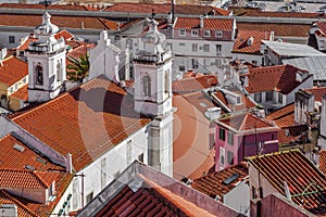 Sao Miguel Church in Alfama District with orange rooftops seen from Miradouro de Santa Luzia. Lisbon, Portugal photo