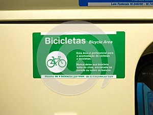Adhesive plate indicating bicycle area in brazilian subway train photo