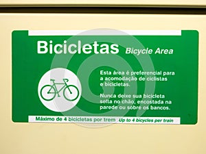Adhesive plate indicating bicycle area in brazilian subway train photo