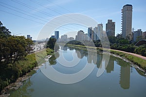 Sao Paulo/Brazil: Tiete river, cityscape and buildings