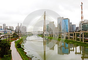 Sao Paulo city landmark Estaiada Bridge reflex in Pinheiros river, Sao Paulo, Brazil photo