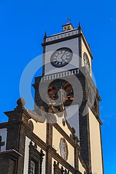 Sao Sebastiao church tower with clock in Ponta Delgada, Sao Miguel island photo