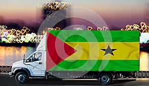 Sao Tome flag on the side of a white van against the backdrop of a blurred city and river. Logistics concept