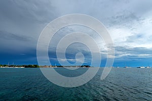 Saona Island coast distant view from water photo