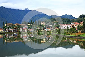 Sapa valley cityscape with reflection on the lake