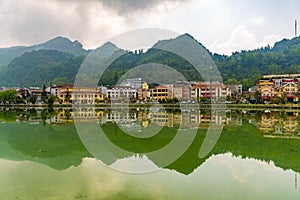 Sapa valley cityscape with reflection on the lake in the morning, Vietnam