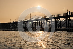 Saphan Mon Mon Bridge, the large old wooden bridge across Song Karia river in Sangklaburi District, Kanchanaburi, Thailand