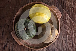 Sapote fruit, cherimoya and grapefruit in a wood bowl