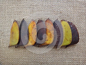 Sappanwood pods unripe and dry on jute background