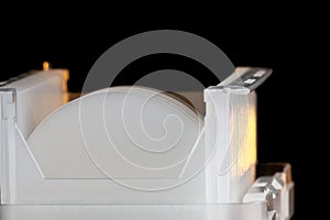 Sapphier Wafers in white plastic holder box A wafer is a thin slice of semiconductor material, used in electronics for