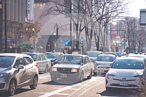 SAPPORO HOKKAIDO, JAPAN - NOV 2018 : traffic on rush hour in downtown Sapporo city on winter season