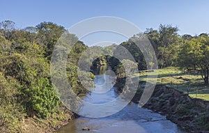 Sapucai Mirim River, a clean river surrounded by trees. Paraisopolis town, south of Minas Gerais, Brazil.