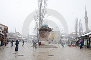 Sarajevo, Bascarsija, city centre at winter day. Old town quarter and Sebilj fountain. Tourist destination and famous landmark. Th