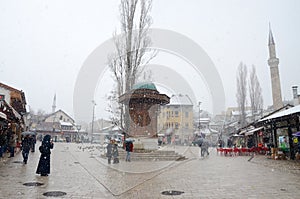 Sarajevo, Bascarsija, city centre at winter day. Old town quarter and Sebilj fountain. Tourist destination and famous landmark. Th