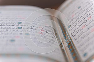 Sarajevo, Bosnia and Herzegovina, 20th february 2023 Muslim beads and Koran or Qoran on wooden table. Islamic religion concept