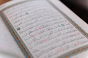 Sarajevo, Bosnia and Herzegovina, 20th february 2023 Muslim beads and Koran or Qoran on wooden table. Islamic religion concept